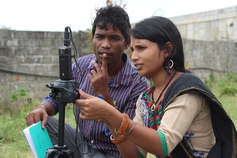 The villagers come together to film the videos.